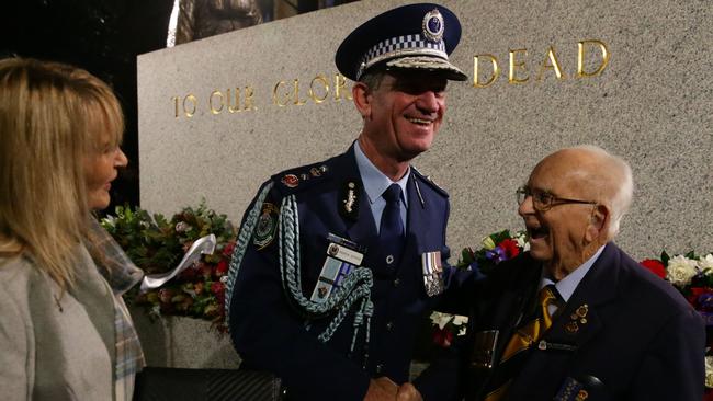 Police Commissioner Andrew Scipione greets Wally Scott-Smith in Martin Place. Picture: Bill Hearne