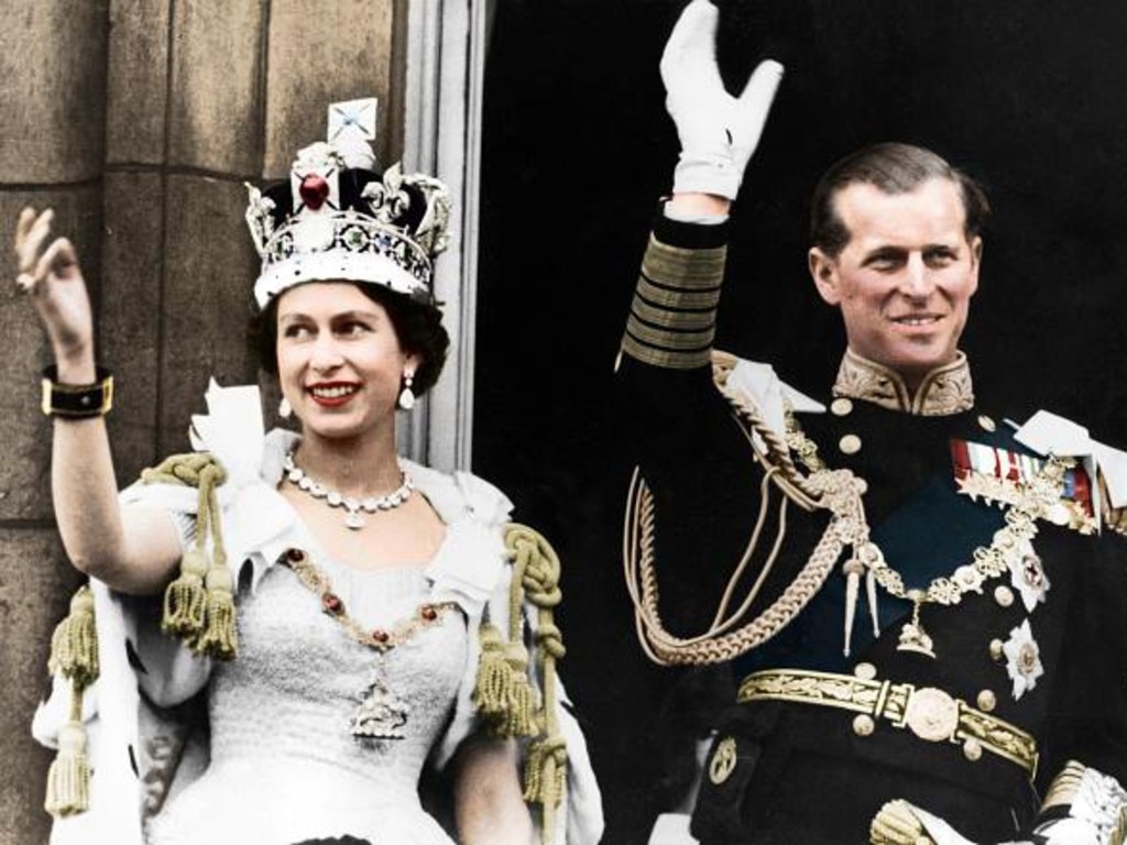 Queen Elizabeth II and the Duke of Edinburgh on the day of their coronation, Buckingham Palace, 1953. (Colorised black and white print) (Photo by The Print Collector/Getty Images)