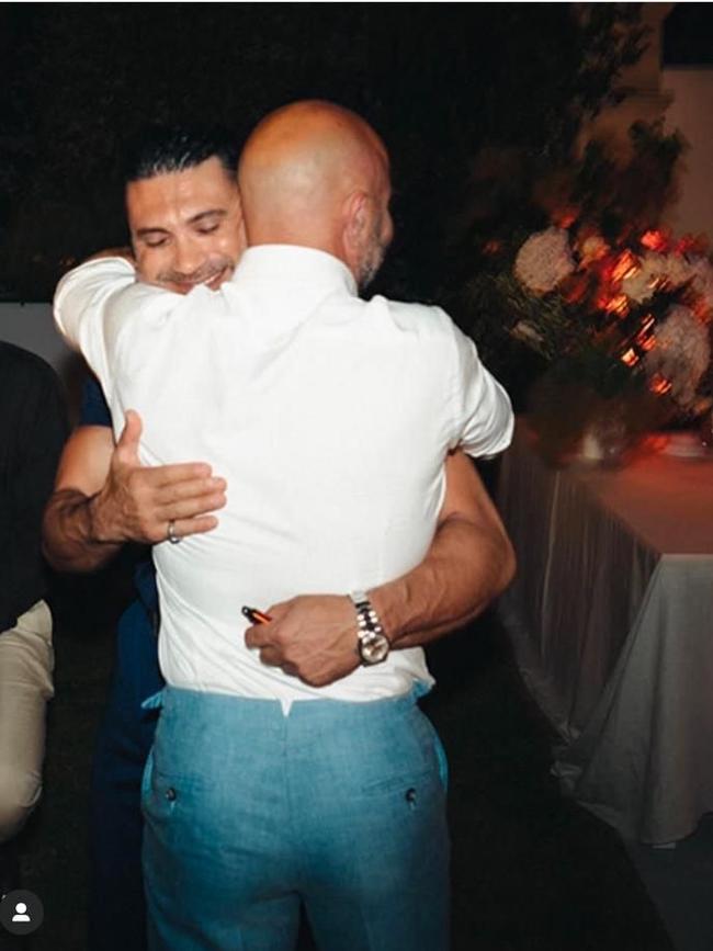 Deniz Bakir hugging Nick Stavropoulos (right).