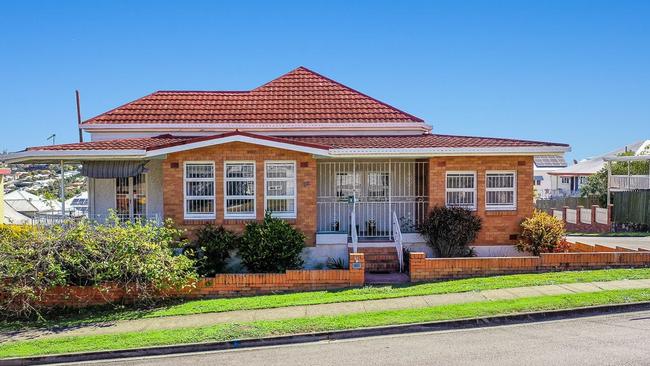 This property at 12 Hunter St, Albion, sold for $500,000 above reserve at auction in 2021.