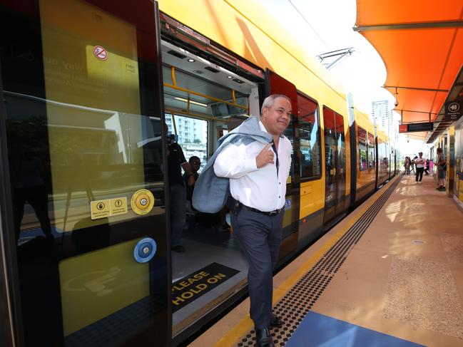 Gold Coast Mayor Tom Tate arrives by light rail yesterday to announce federal funding for the third stage. Picture: Glenn Hampson