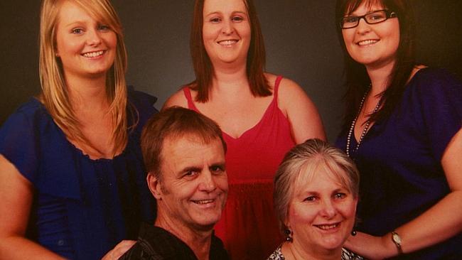 Bob and Kathy Lawton in a family photo with their daughters.