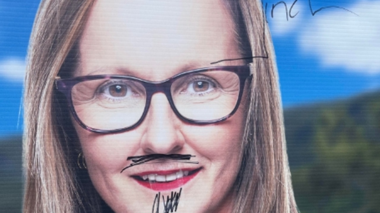 A corflute for One Nation Gaven candidate Sandy Roach vandalised at Pacific Pines.