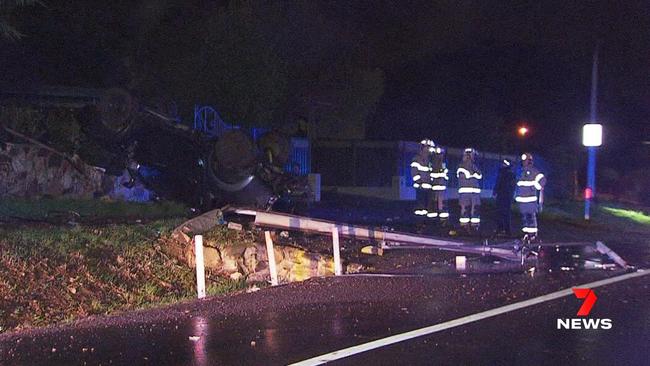 A 20-year-old driver has been taken to hospital after his ute flipped on its roof after crashing into a Stobie pole at Torrens Park. . Picture: 7NEWS