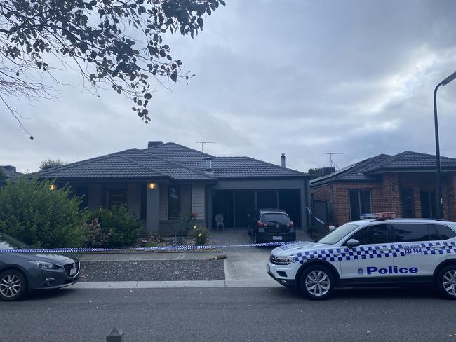 Police tape cordons off the single-storey home on Sunday morning. Picture: Euan Kennedy