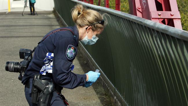 Police search the area where David Fisher jumped into the river. Pic: Annette Dew