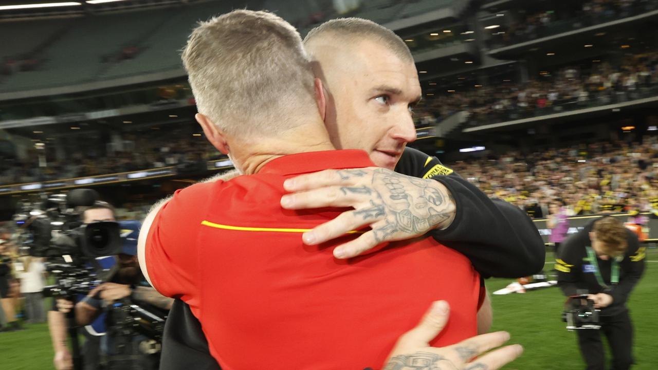 MELBOURNE, AUSTRALIA - AUGUST 24:  Dustin Martin of the Tigers and Damien Hardwick, Senior Coach of the Suns embrace after during the round 24 AFL match between Richmond Tigers and Gold Coast Suns at Melbourne Cricket Ground, on August 24, 2024, in Melbourne, Australia. (Photo by Darrian Traynor/Getty Images)