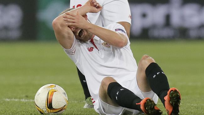 Sevilla’s Michael Krohn-Dehli reacts after an injury.