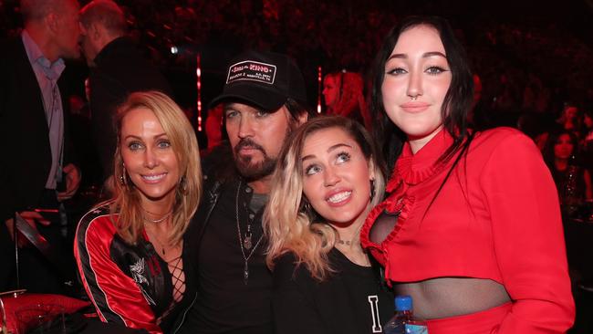 Noah with her mother Tish, father Ray Cyrus and sister Miley at the 2017 iHeartRadio Music Awards. (Picture: Christopher Polk/Getty Images)