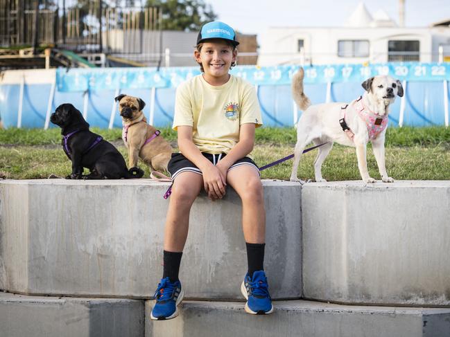 Kobe Stroem with his dogs (from left) Pickles, Waffles and Chilli, after Pickles and Waffles competed in the dock diving at the Toowoomba Royal Show, Friday, March 31, 2023. Picture: Kevin Farmer