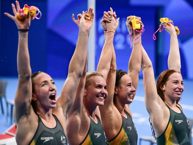 Lani Pallister, Ariarne Titmus, Brianna Throssell and Mollie O’Callaghan celebrate after winning the final of the women's 4x200m freestyle relay. Picture: AFP