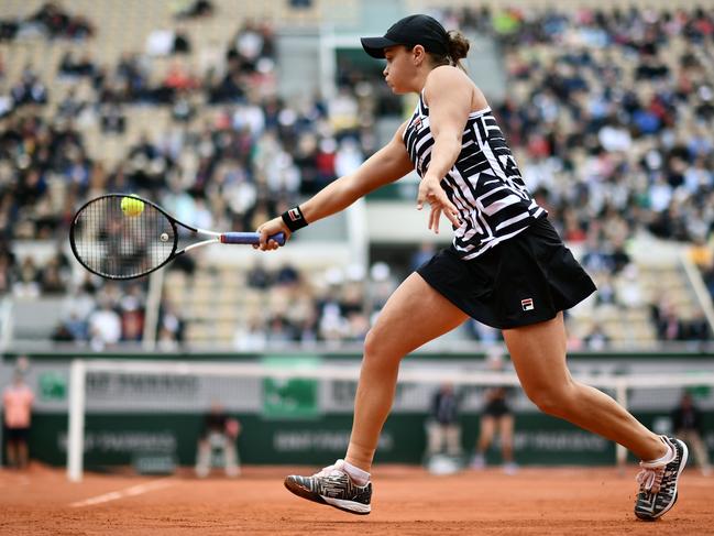 Australia's Ashleigh Barty returns the ball to Amanda Anisimova of the US during their women's singles semi-final match on day 13 of The Roland Garros 2019 French Open. Picture: AFP