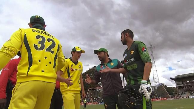 Glenn Maxwell walks past the otustretched hand of Pakistan captain Sarfraz Ahmed  on Sunday.
