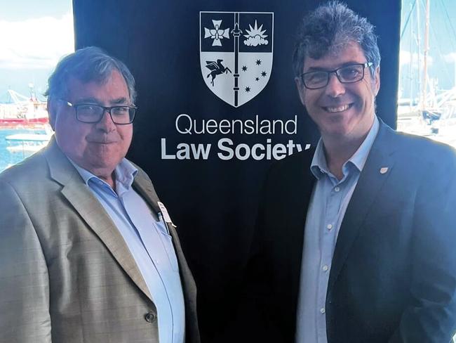 QLS CEO Matt Dunn congratulates David Lewis on his 50-year milestone in Hervey Bay this week. Photo: Queensland Law Society