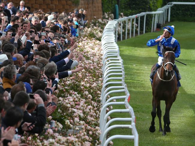 Hugh Bowman parades Australia’s greatest racehorse in front of her adoring fans. Picture: David Crosling