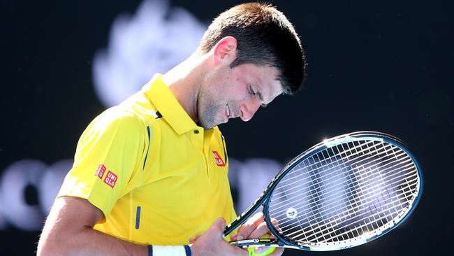 MELBOURNE, AUSTRALIA - JANUARY 18: Novak Djokovic of Serbia reacts in his first round match against Hyeon Chung of Korea during day one of the 2016 Australian Open at Melbourne Park on January 18, 2016 in Melbourne, Australia. (Photo by Quinn Rooney/Getty Images)