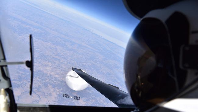 A US Air Force pilot looks down at the suspected Chinese surveillance balloon as it hovers over the country.