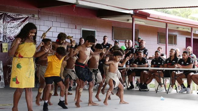 South Sydney Rabbitoh watch the Buri Guman dance group from Yarrabah State School perform a traditional dance at Yarrabah's Jilara Oval. Picture: Brendan Radke