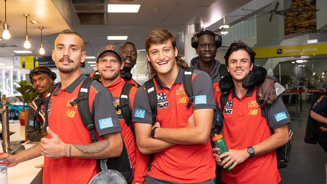 Lloyd Johnston, Joel Jeffrey, Jy Farrar, Mabior Chol, Ned Moyle, Mac Andrew and Elijah Hollands after touching down at Darwin airport. Picture: Pema Tamang Pakhrin