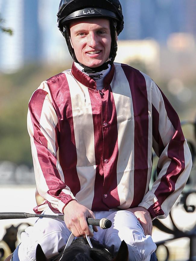 Michael Poy returns to scale at Flemington.