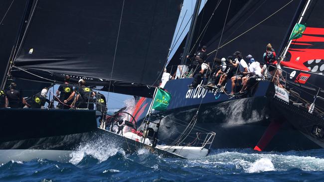 Yachts Moneypenny (L) and Andoo Comanche compete at the start of the Sydney to Hobart yacht race on December 26, 2022 on Sydney Harbour. (Photo by DAVID GRAY / AFP) / -- IMAGE RESTRICTED TO EDITORIAL USE - STRICTLY NO COMMERCIAL USE --