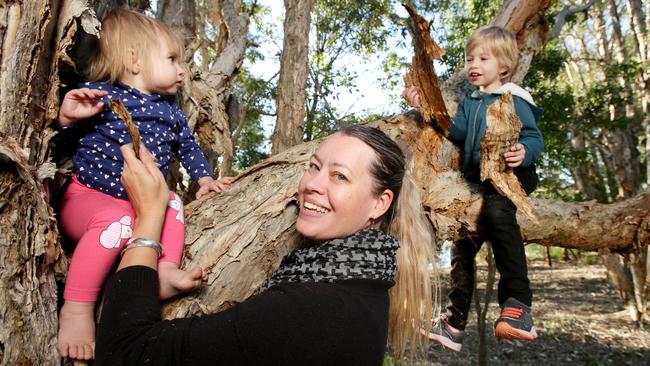 Carmel Vaughan, with her children Kadyn, 4, and Asha, 1, believes outdoor play is a must for their development. Picture: AAP/Steve Pohlner