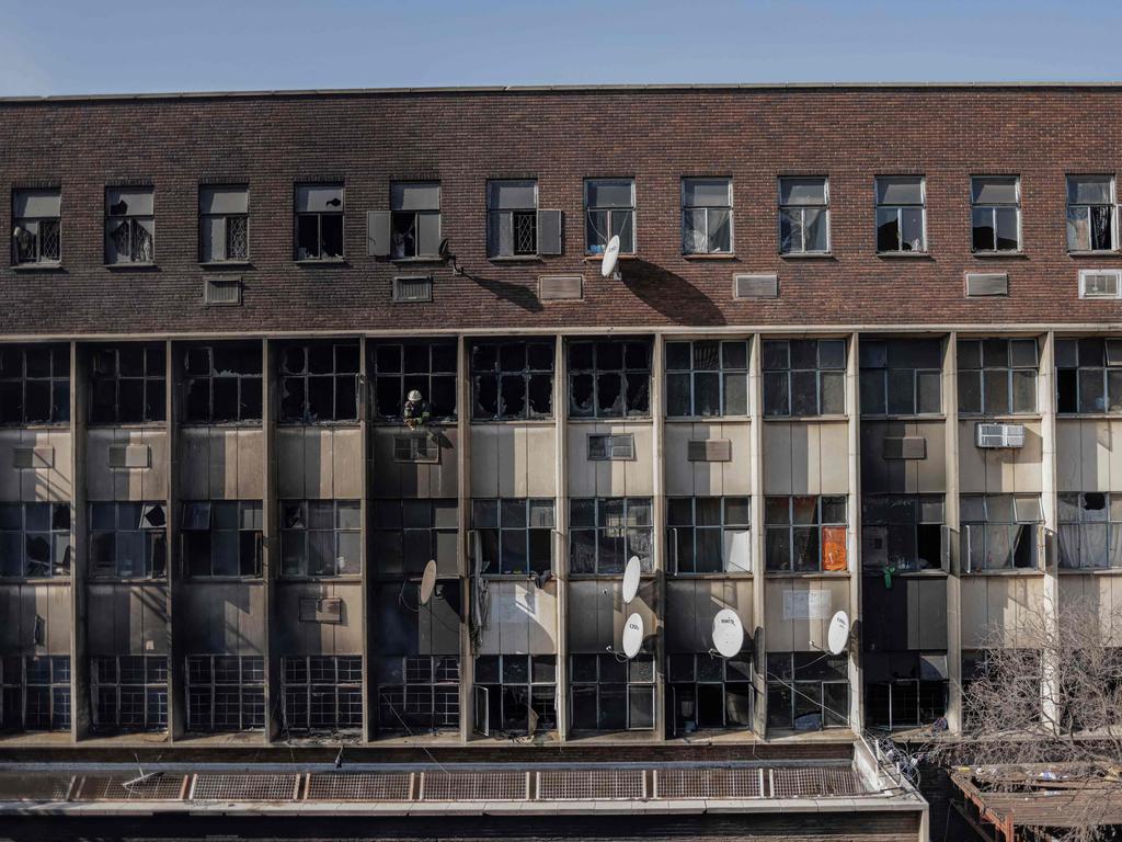 The building was housing migrants. (Photo by Michele Spatari / AFP)