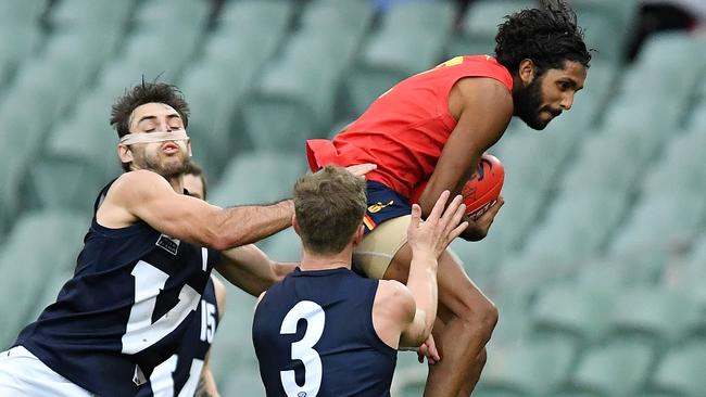 South Australia's Anthony Wilson takes a high-flying mark against Victoria. Picture: Tom Huntley