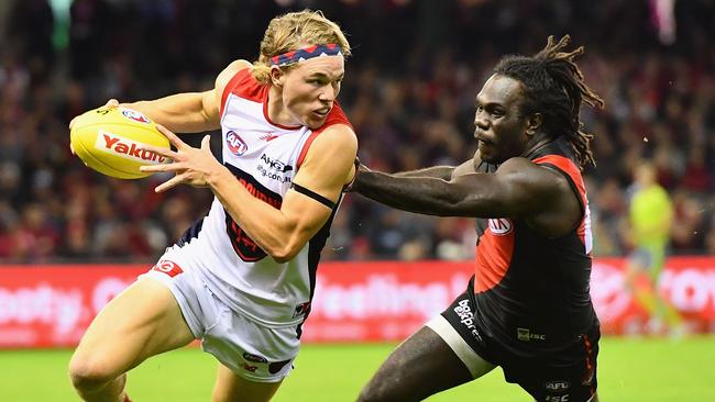 Jayden Hunt bursts away from Anthony McDonald-Tipungwuti. Picture: Getty Images