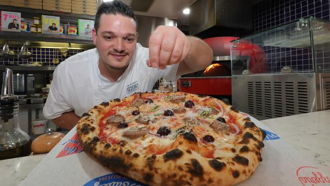 Jamie's Pizzeria head chef Stefano Mauro makes a the famed sausage pizza, one of the new dishes from Jamie Oliver’s new cookbook, 7 Ways. Picture: Glenn Hampson