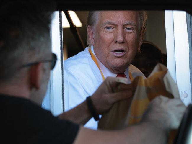 Mr Trump said he will “never forget this experience” after serving fries at a US Maccas. Picture: Getty Images via AFP