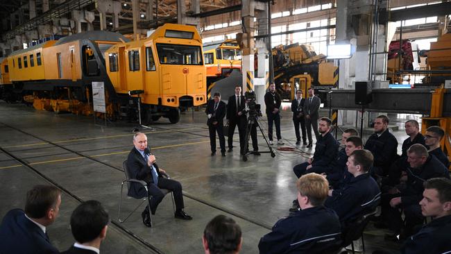 Vladimir Putin meets workers at a Russian factory this month. Picture: AFP