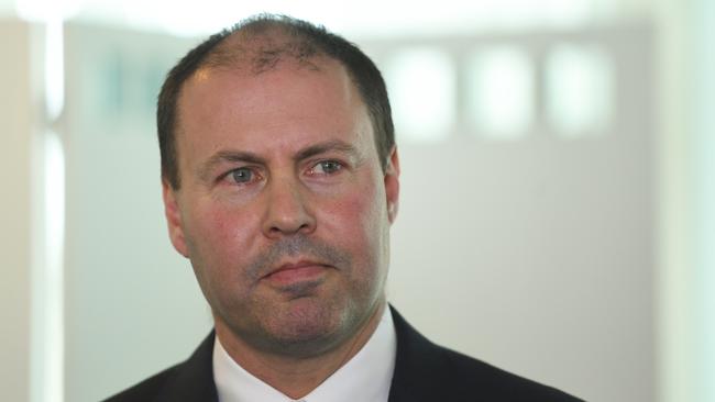 Australian Treasurer Josh Frydenberg reacts during a signing ceremony for a Memorandum of Understanding at Parliament House in Canberra, Monday, November 5, 2018. (AAP Image/Lukas Coch) NO ARCHIVING