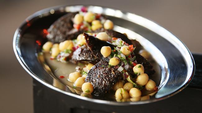 The morcilla – hunks of grilled blood sausage among a tumble of braised chickpeas with a pleasingly acidic and spice dressing – is delicious. Pictures: SAM ROSEWARNE