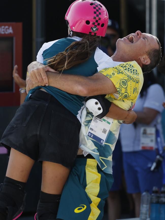 Arisa Trew is hugged by a team official. Picture: Michael Klein