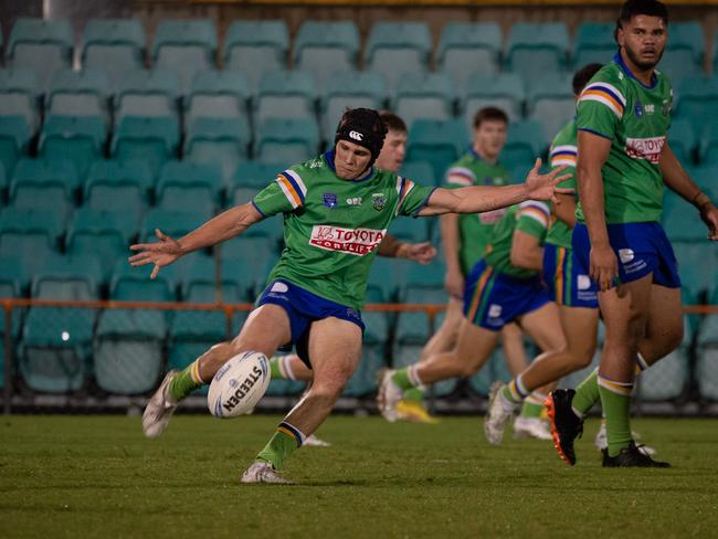 Owen Pattie kicks for the Raiders. Picture: Thomas Lisson.