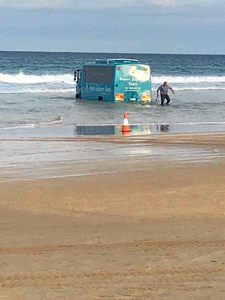 The Central Queensland Plane Spotting Blog has shared photos of a bus attempting to rescue the Air Fraser Island Airvan ahead of high tide. Picture: CQ Plane Spotting Blog