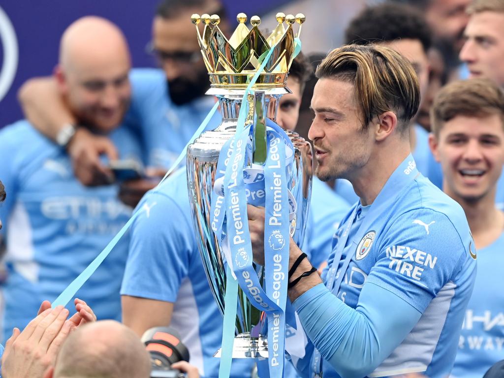 Jack Grealish of Manchester City celebrates with the Premier League trophy after their side finished the season as Premier League champions. Picture: Shaun Botterill/Getty Images.