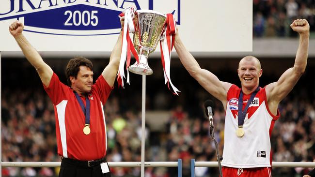 Paul Roos and Barry Hall raise the 2005 premiership cup.