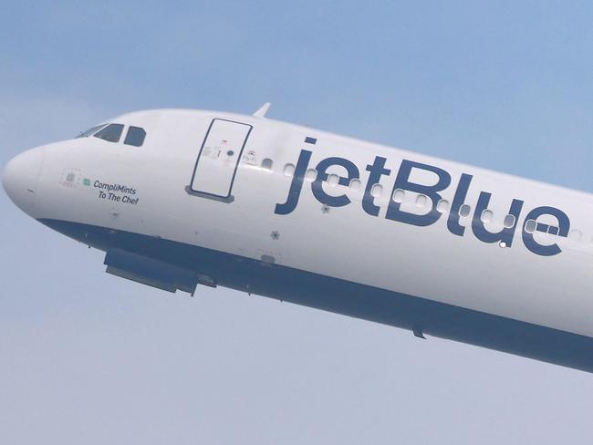 LOS ANGELES, CALIFORNIA - JANUARY 03: A JetBlue plane takes off from Los Angeles International Airport (LAX) on January 03, 2025 in Los Angeles, California. JetBlue has been fined $2 million by the Department of Transportation for âoperating multiple chronically delayed flightsâ which marks the first time an airline has received such a penalty.   Mario Tama/Getty Images/AFP (Photo by MARIO TAMA / GETTY IMAGES NORTH AMERICA / Getty Images via AFP)