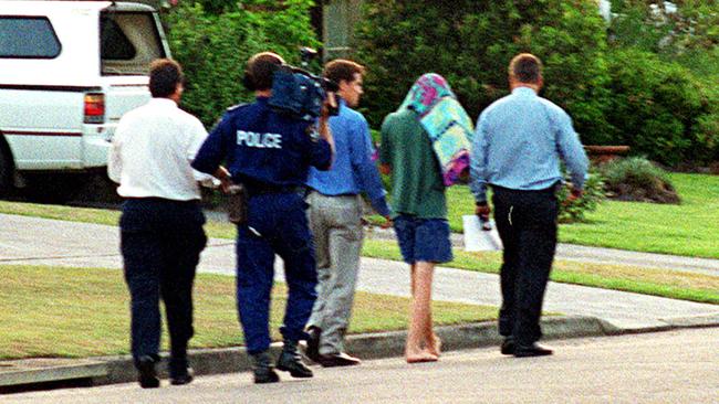 A towel draped over 13-year-old SLD after being arrested for the murder of three-year-old Courtney Morley-Clarke on the Central Coast.