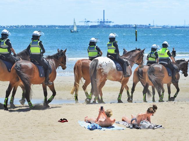 Police patrol St Kilda beach. Picture: Tony Gough