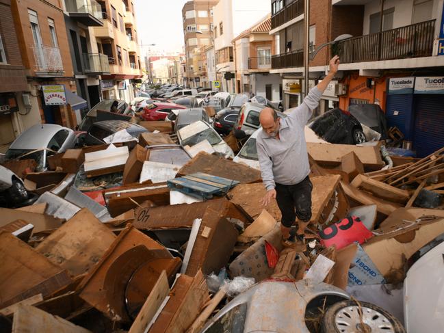 A man walks through a debris-covered street in Sedava. Picture: Getty Images