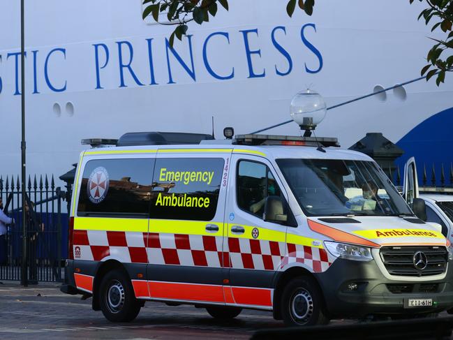 An ambulance waits at the Overseas Passenger Terminal on Saturday morning. Picture: Tim Hunter