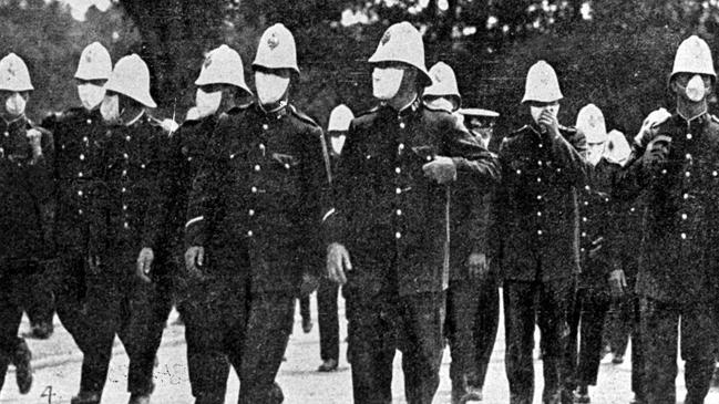 NSW police officers wear masks in Sydney during the Spanish flu pandemic in 1919.