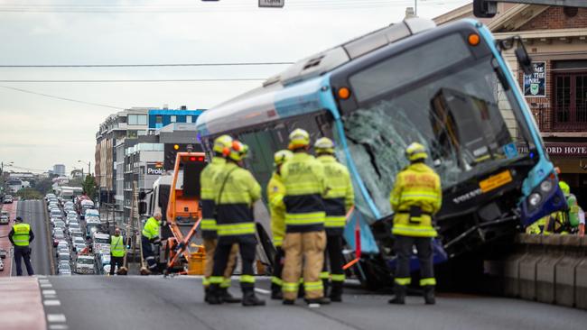 The bus crashed on the corner of Victoria Rd and Lyons Rd in Drummoyne causing extensive traffic delays. Picture: Christian Gilles