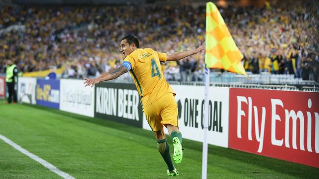 Tim Cahill celebrates scoring with a plane gesture, rather than boxing the corner flag.