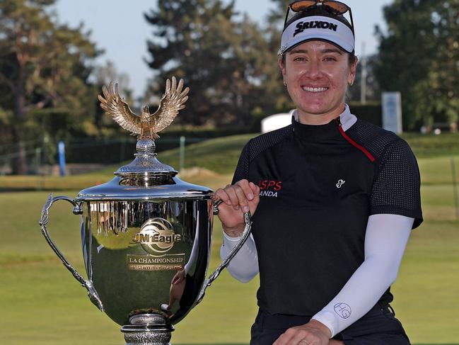 LOS ANGELES, CALIFORNIA - APRIL 28: Hannah Green of Australia poses with the trophy after winning the JM Eagle LA Championship presented by Plastpro at Wilshire Country Club on April 28, 2024 in Los Angeles, California.   Harry How/Getty Images/AFP (Photo by Harry How / GETTY IMAGES NORTH AMERICA / Getty Images via AFP)