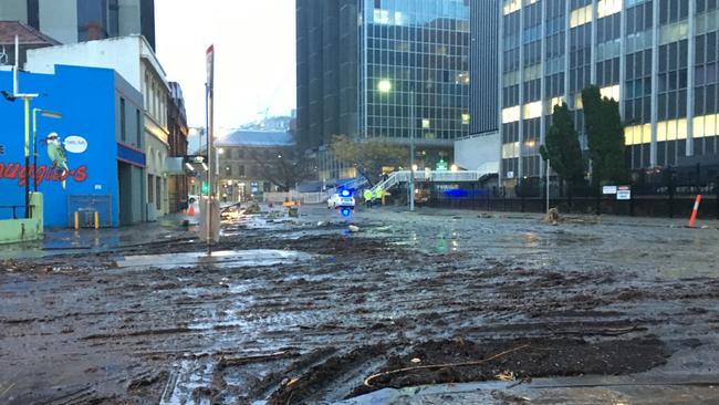 Sludge left behind in Collins St by flash flooding in Hobart's CBD overnight when the rivulet burst its banks. Picture: SAM ROSEWARNE