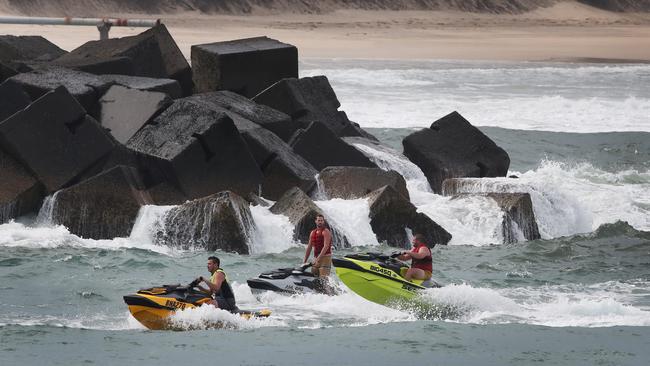 Jetski Riders at the Northern wall of the Southport Seaway near where a boat came to grief earlier in the day. Picture: Glenn Hampson.